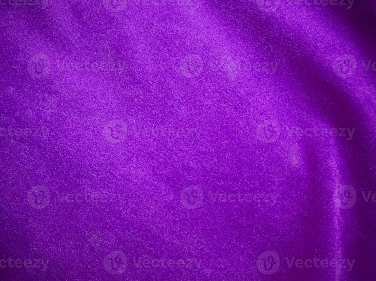 Purple velvet fabric texture used as background. Luxury violet fabric background of soft and smooth textile material. There is space for text. photo