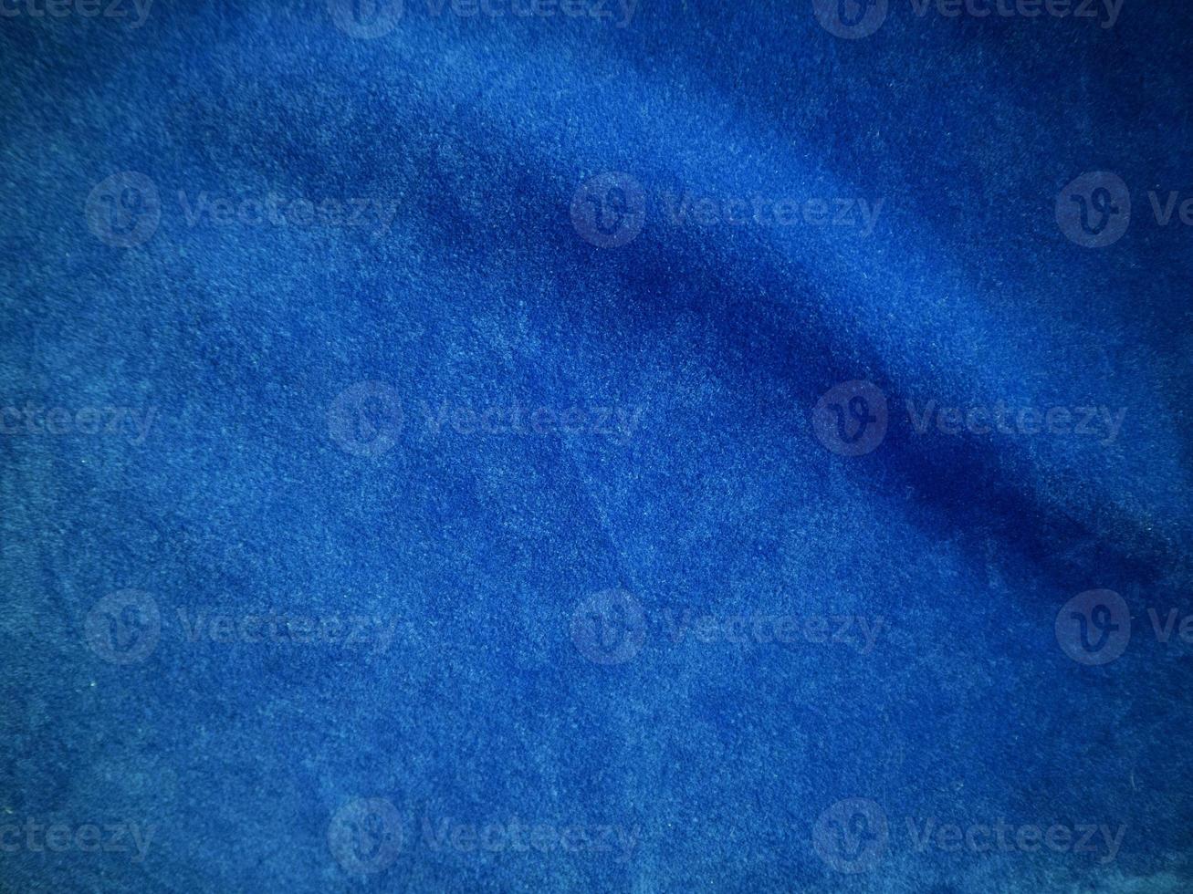 Blue velvet fabric texture used as background. Empty blue fabric background of soft and smooth textile material. There is space for text. photo