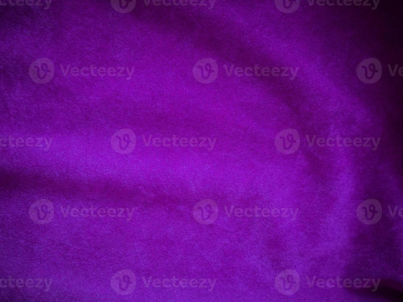 Purple velvet fabric texture used as background. Luxury violet fabric background of soft and smooth textile material. There is space for text. photo