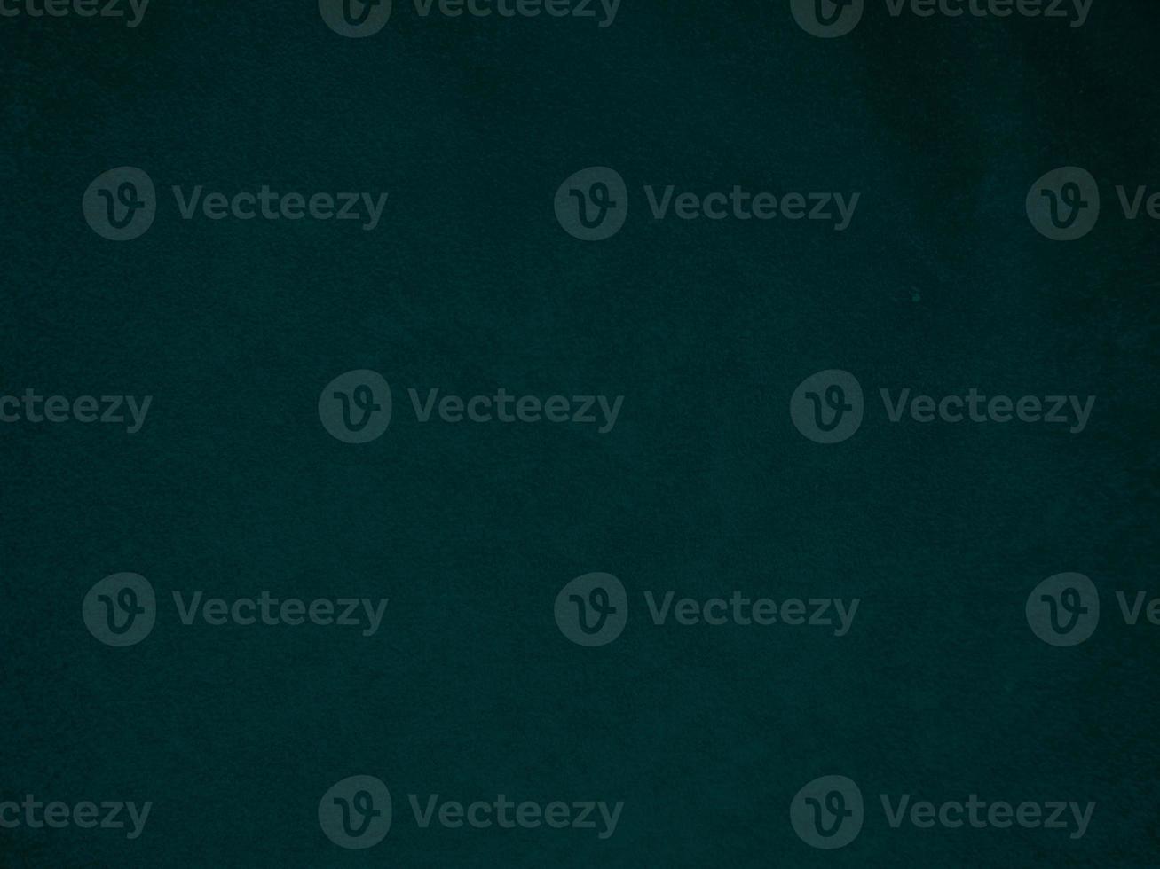 Dark green old velvet fabric texture used as background. Empty green fabric background of soft and smooth textile material. There is space for text.. photo