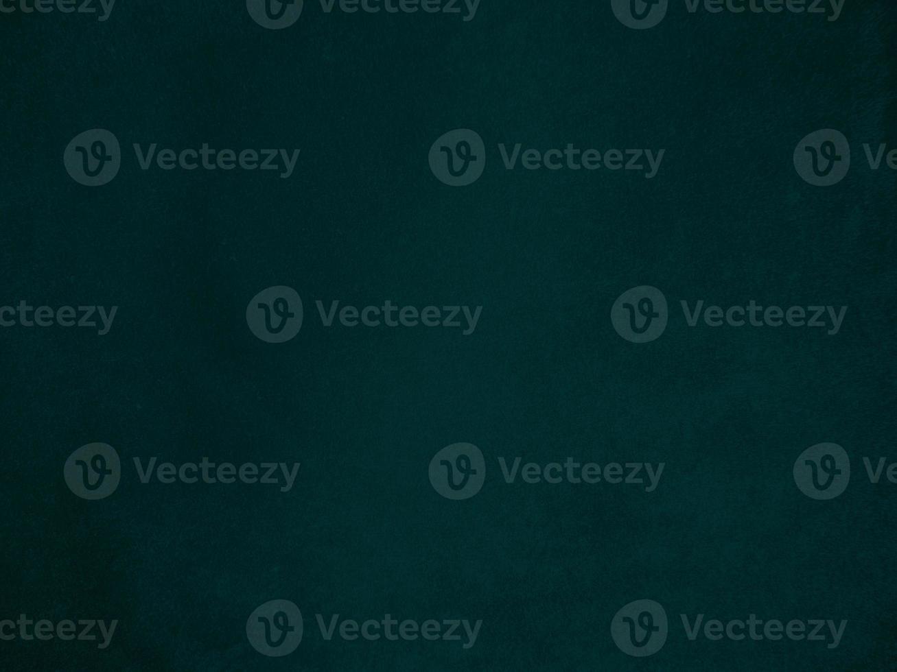 Dark green old velvet fabric texture used as background. Empty green fabric background of soft and smooth textile material. There is space for text.. photo
