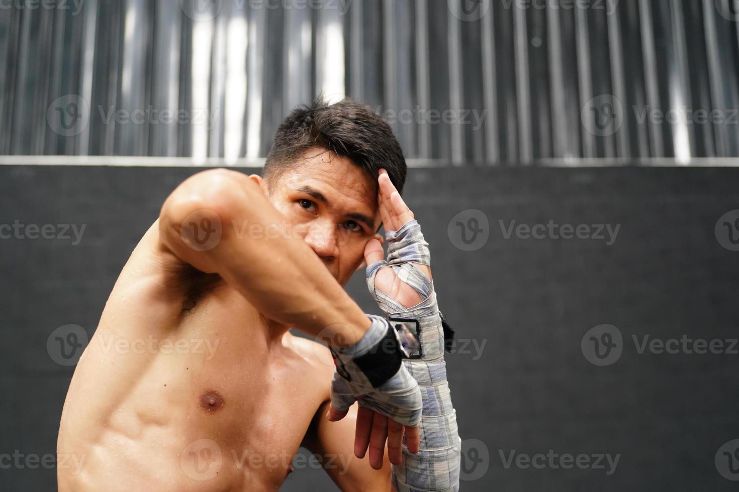 Muay Thai, The martial art of Thailand, The boxer's rehearsal punching before the real fight on the stage It prepares the body for each boxing match. photo