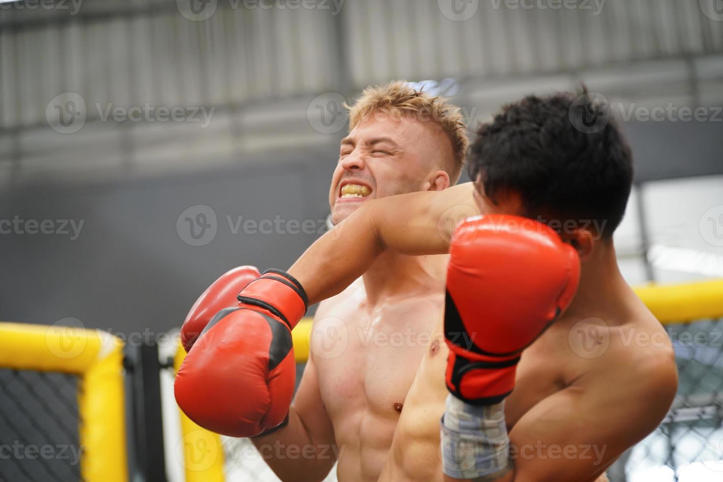 Muay Thai, The martial art of Thailand, A powerful elbow that hits the opponent's face or head. Causing the opponent to have broken wounds, bleeding, may lose because of a wound that is fatal photo