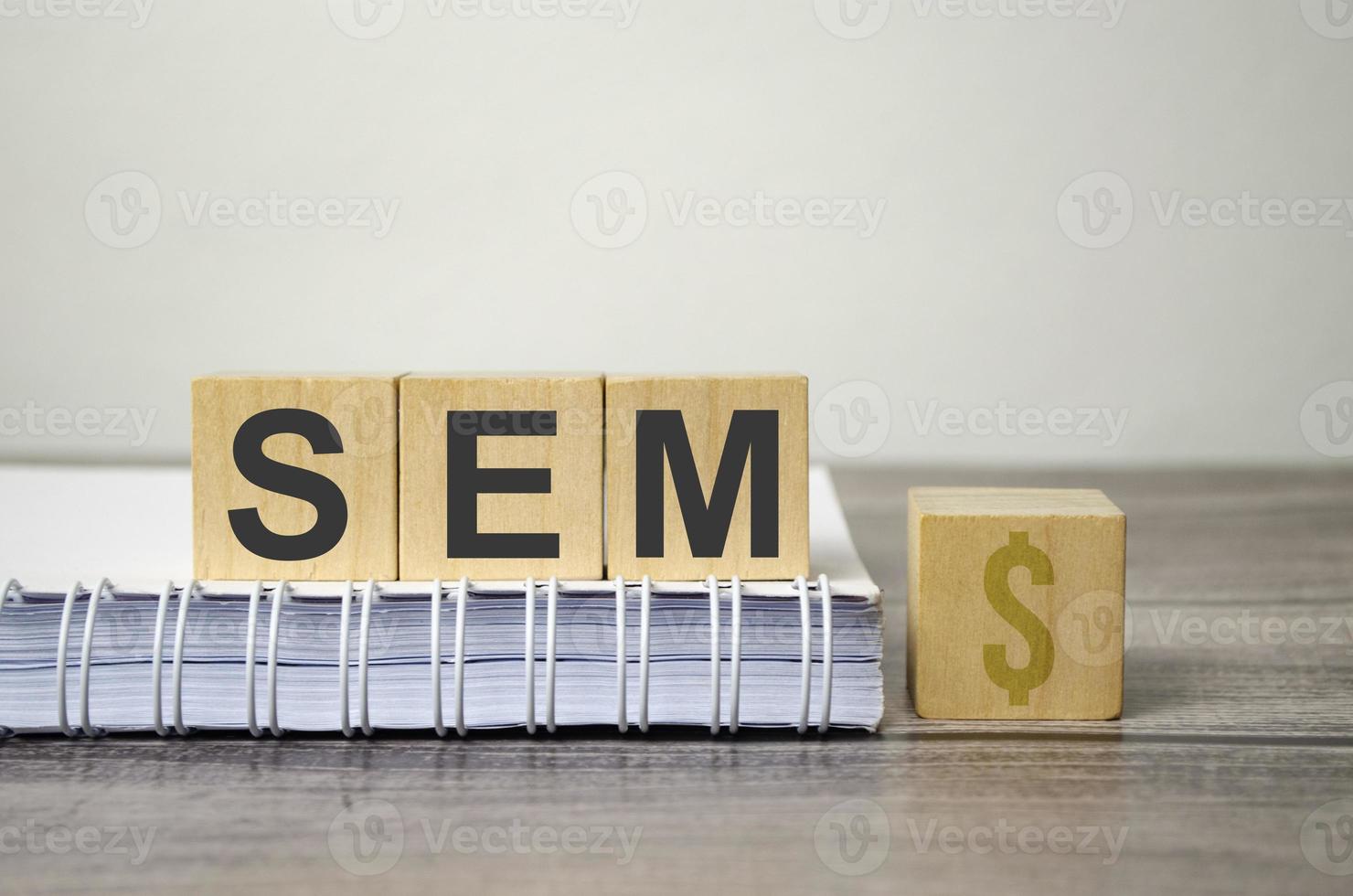 sem text from wooden blocks on a grey wooden background photo