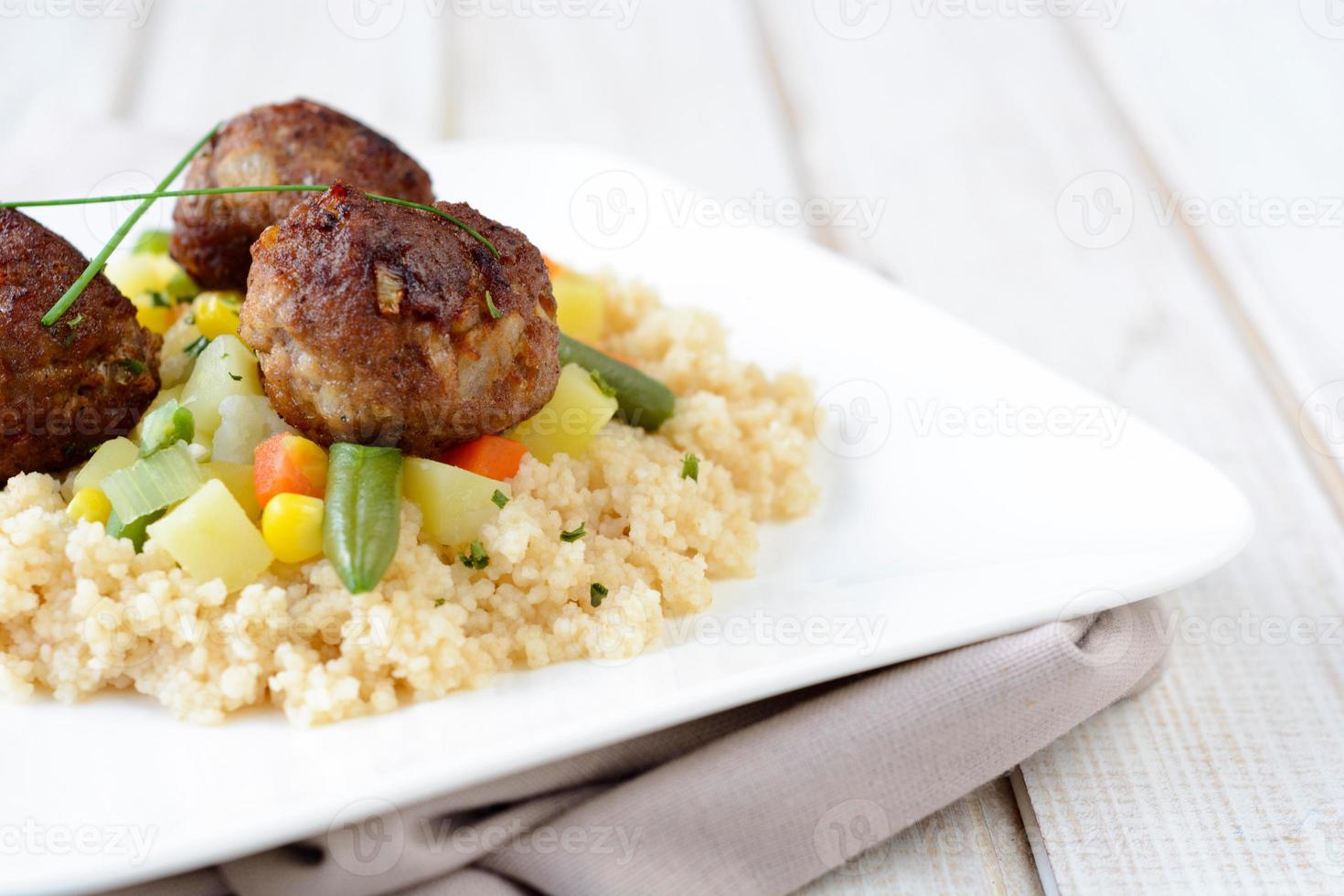 Couscous and meat balls photo