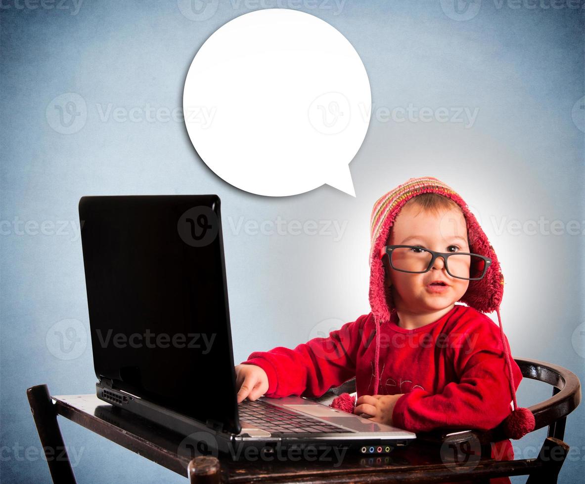 Child with laptop computer photo