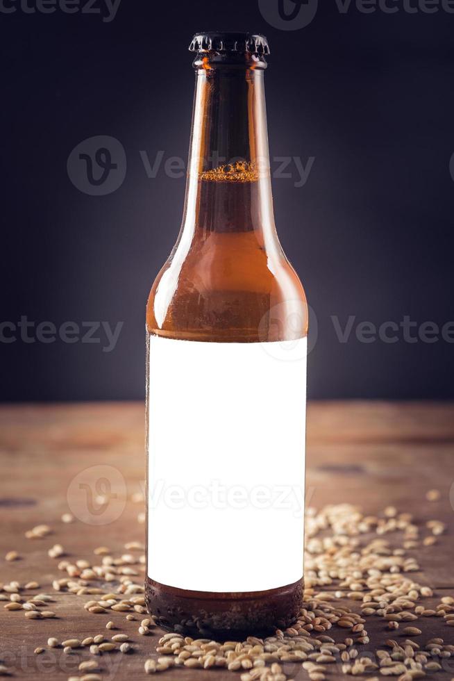 Blank label on beer bottle photo