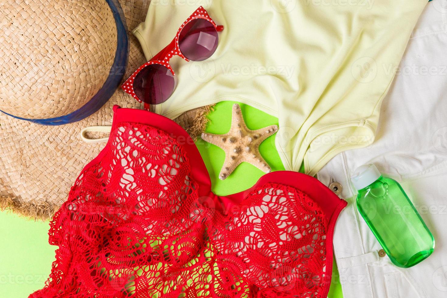 Woman summer outfit top view on color background. Fashion vacations concept photo