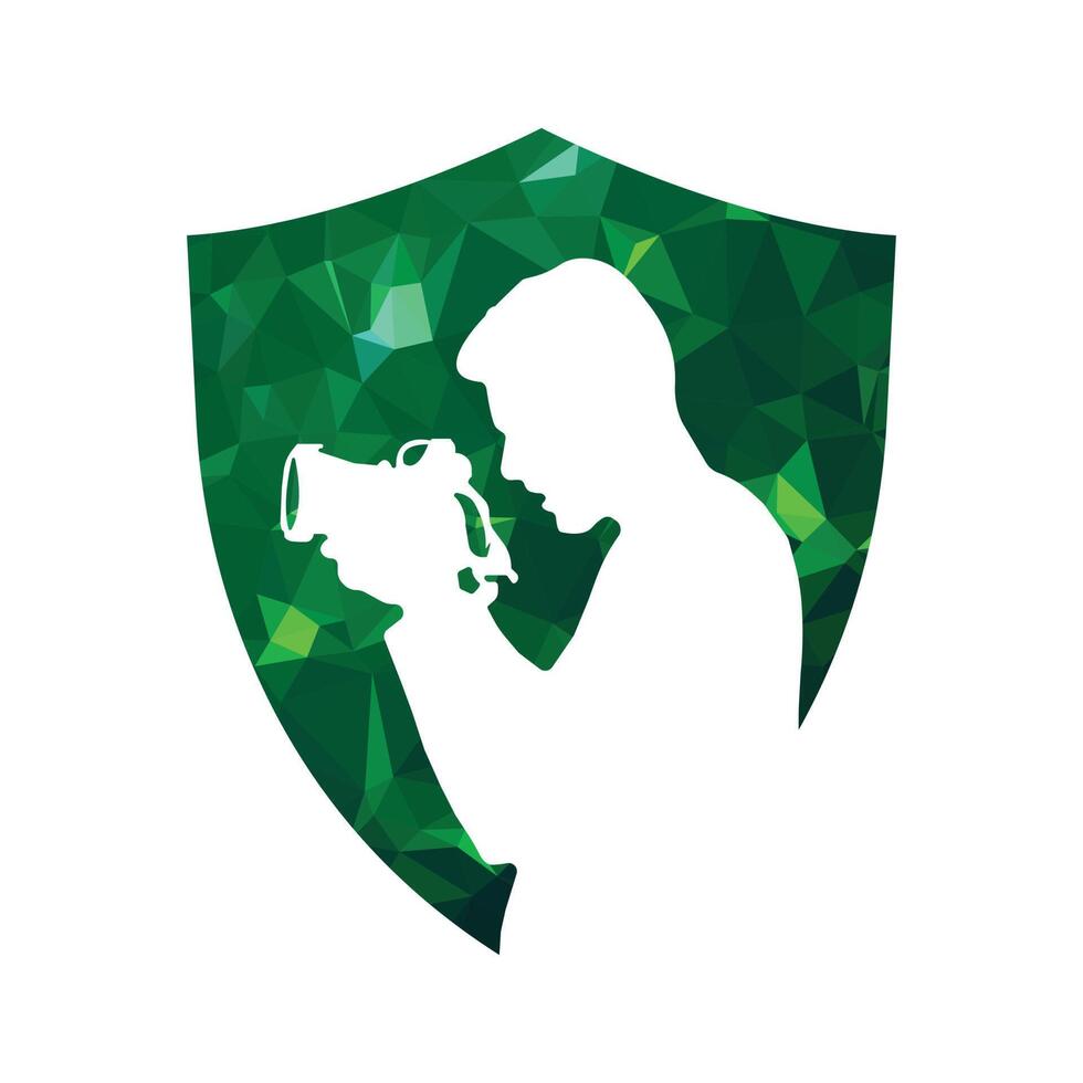 Photographer with camera on green polygonal shield. Vector illustration.