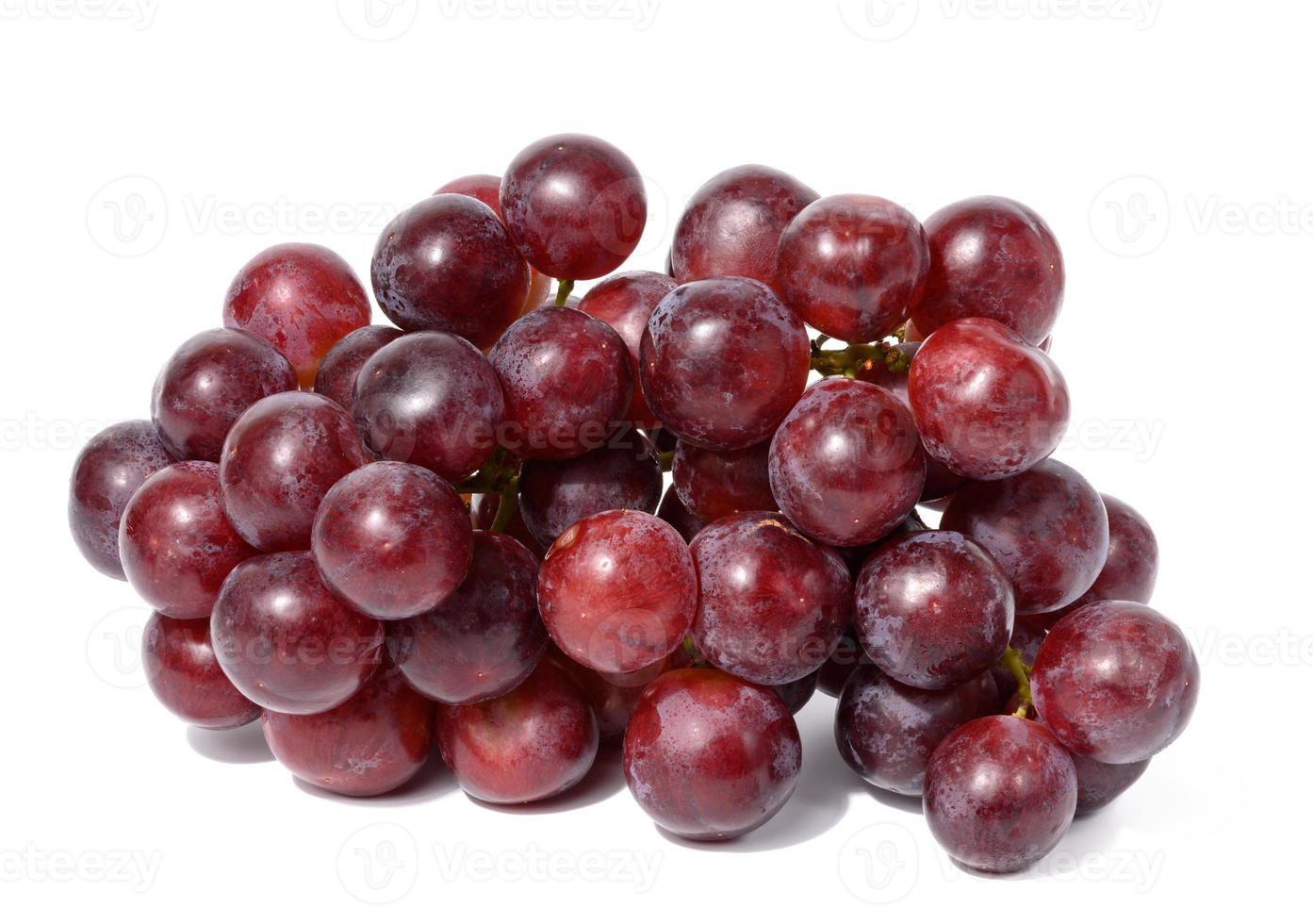 Ripe red grapes on a white isolated background, wine grapes photo