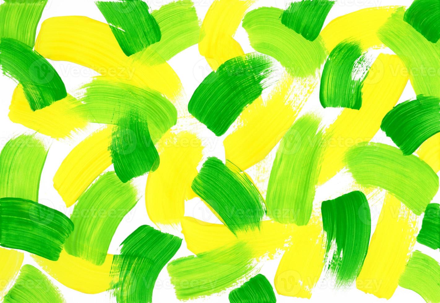 Chaotic large strokes of green, light green and yellow paint on textured horizontal white canvas. Abstract acrylic, gouache or tempera colorful paint texture. Artistic background with copy space. photo