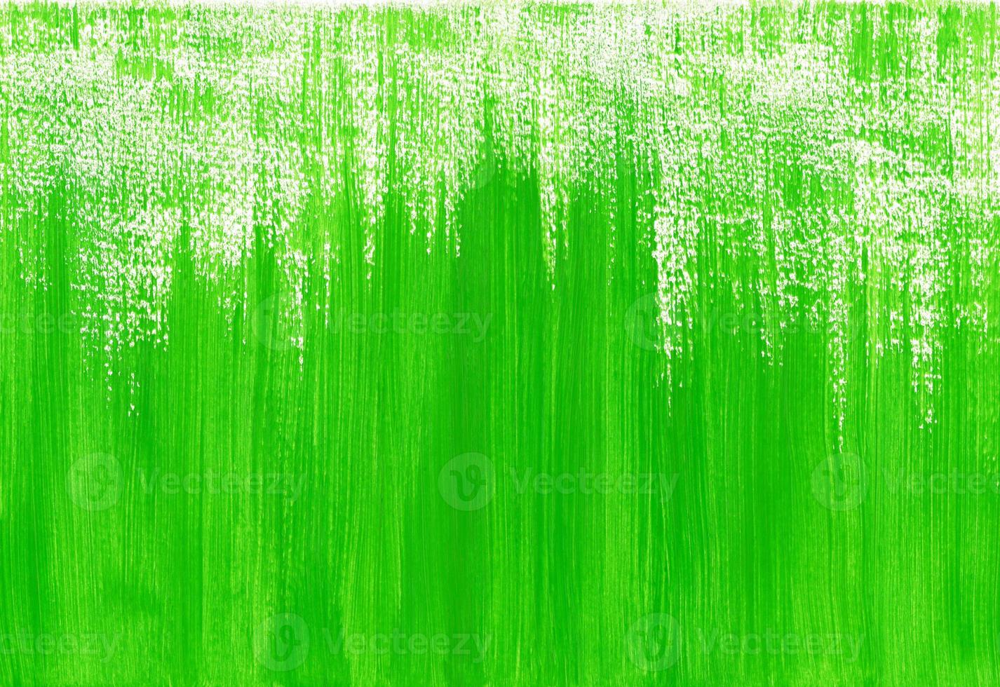 Bright green paint artistic horizontal background with place for text. Brushstrokes of light green paint from bottom to top. Abstract spring green grass concept. photo