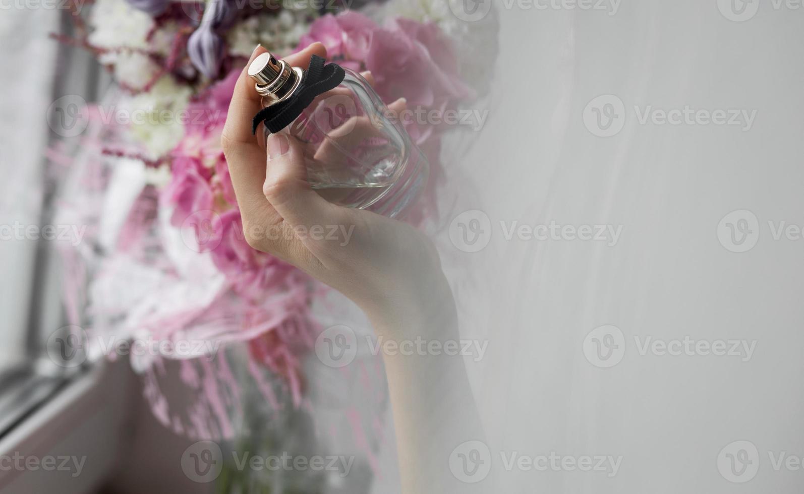 lady with flowers and bottle perfume photo