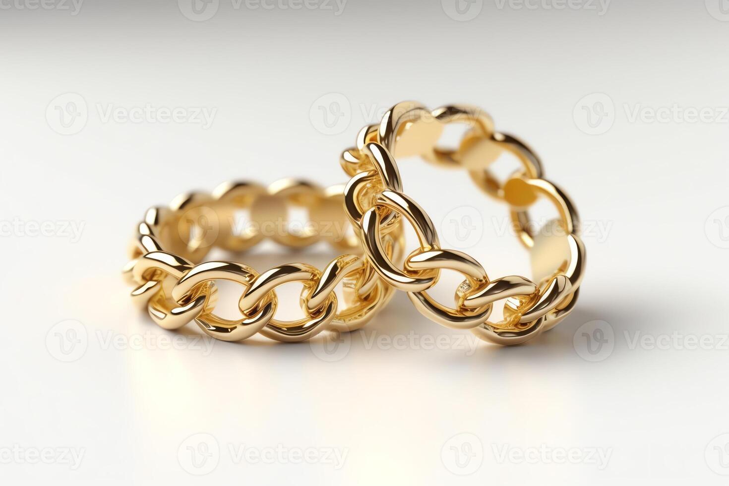 2 Gold Wedding Rings Linked Like Chains In 3d Rendering On A White Background photo