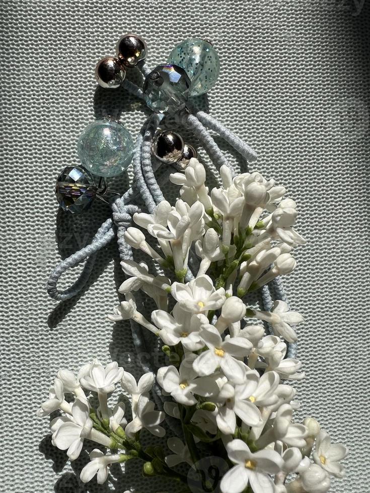 White Lilac flowers with beads photo