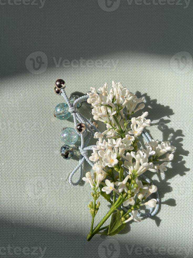 White Lilac flowers with beads photo