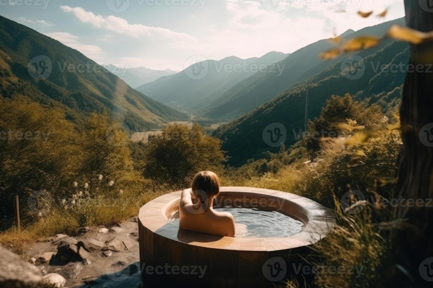 Back view of nacked woman relaxing in jacuzzi outdoors. photo