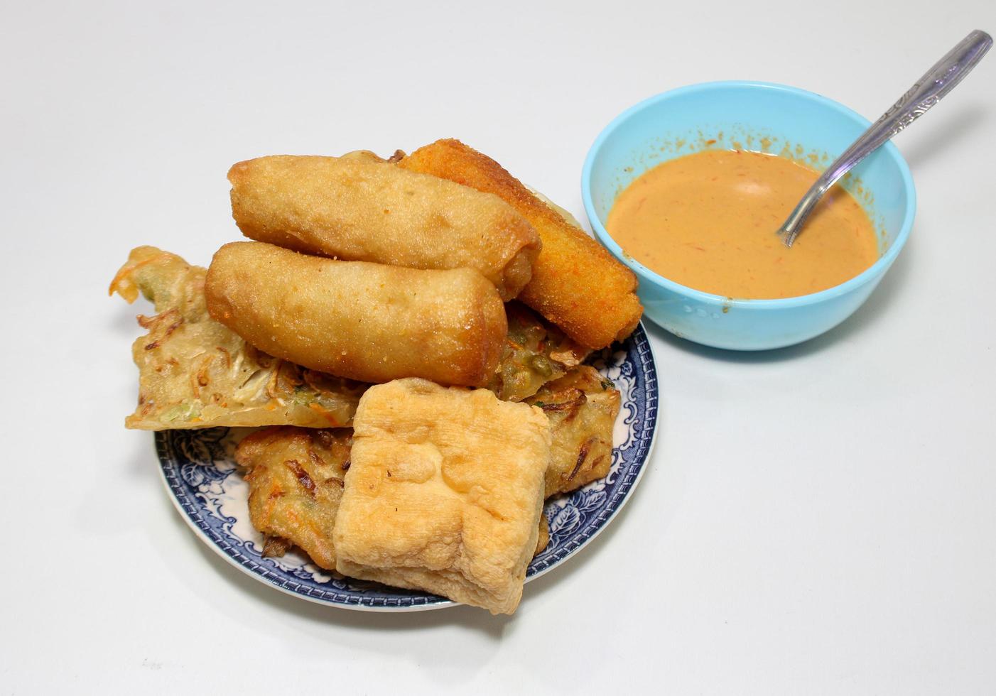 Gorengan is a typical snack from Indonesia. consisting of bakwan risol, tofu. This food is usually sold by street vendors at cheap prices. photo