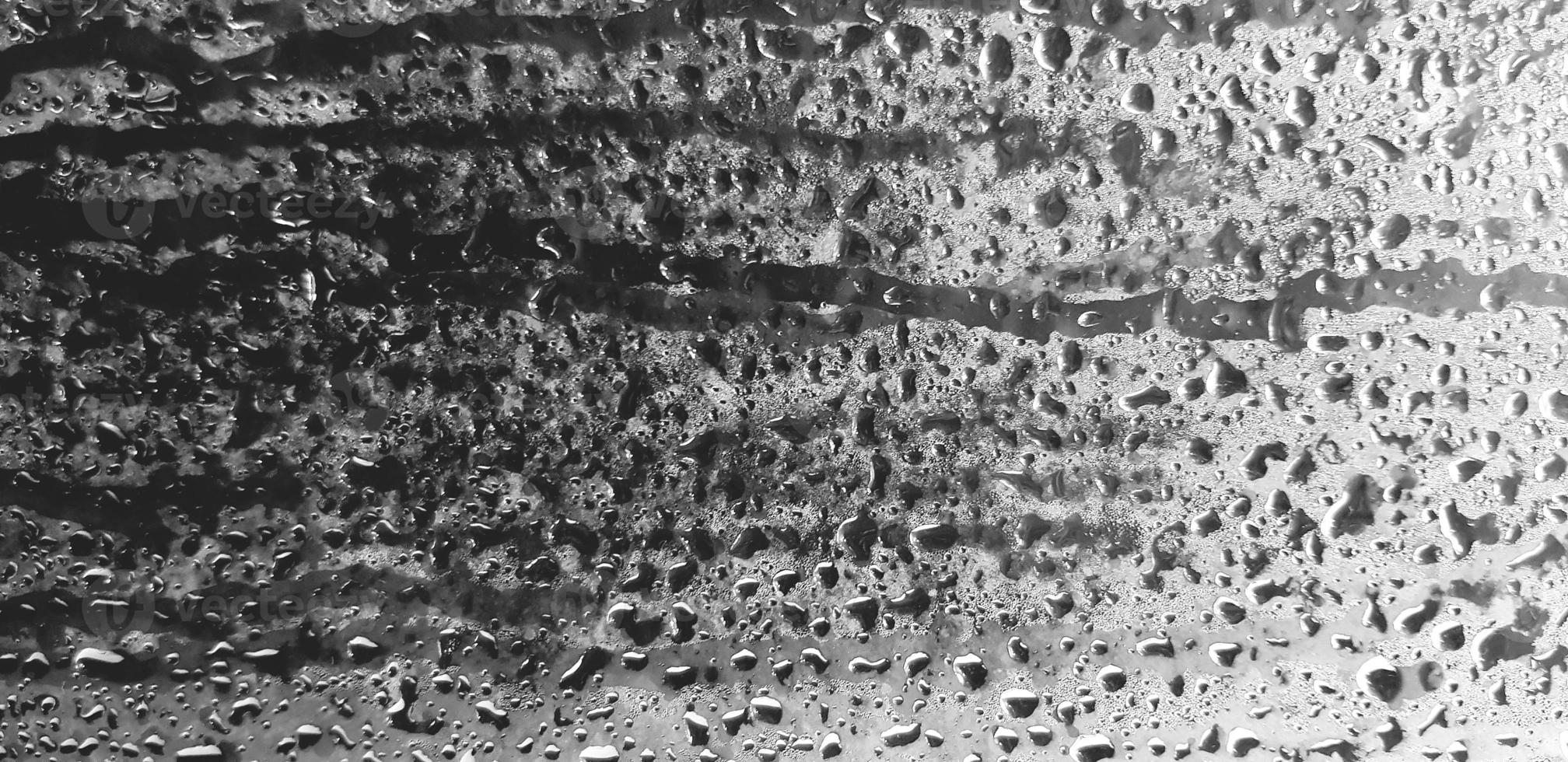 Art pattern of steam, vapor or water droplet on glass or mirror for background. Selective focus and Blurred. Humidity, Abstract wallpaper and wet after rain drop concept photo