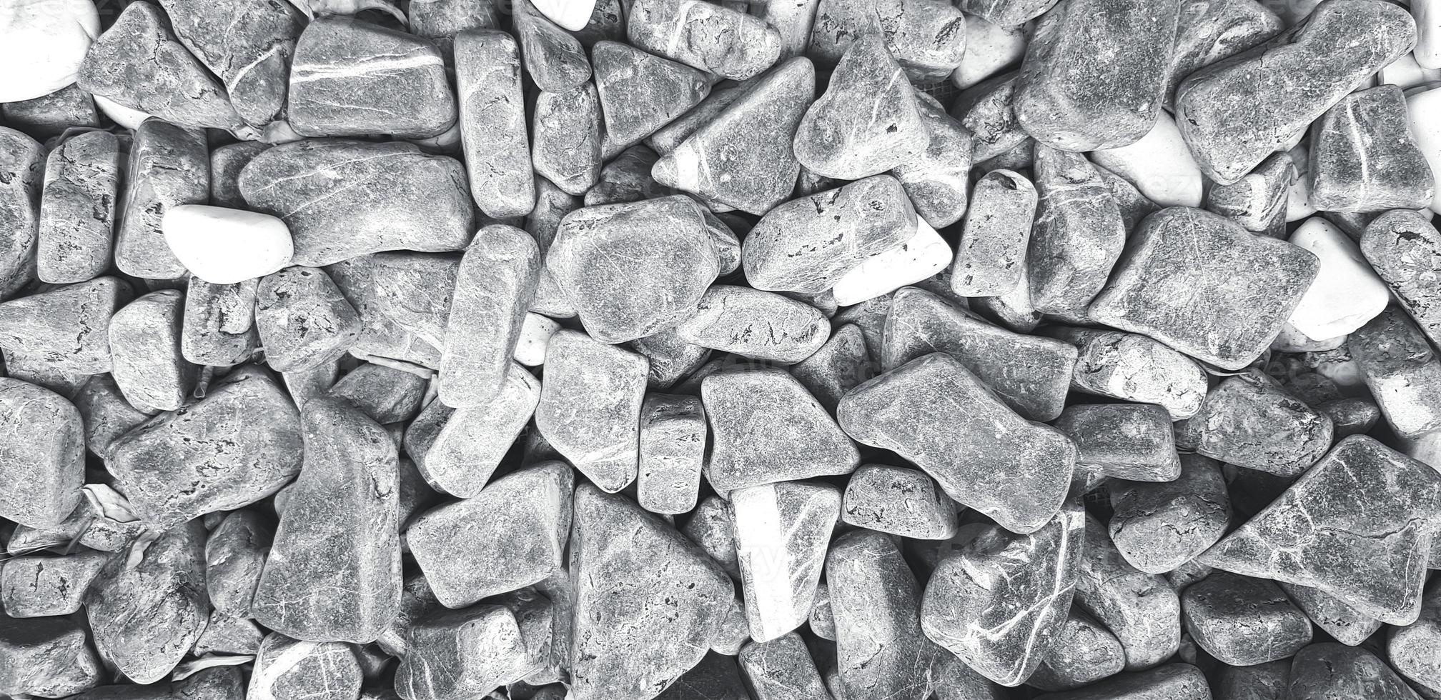 Pattern of gravel, rock or small stone for background in black and white style. Hard material, Art wallpaper and Group of object concept photo
