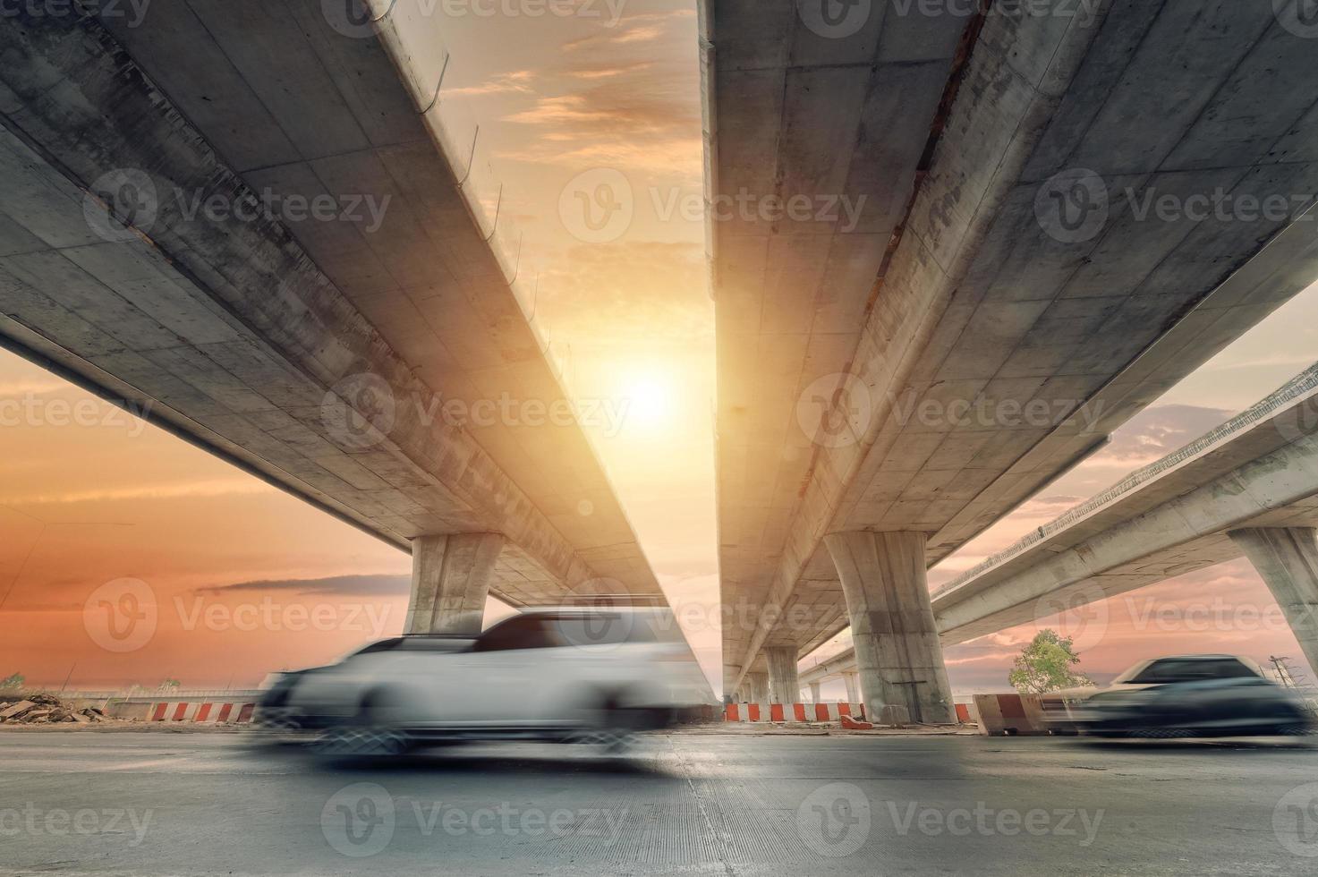 Construction of asphalt highways and overpasses in Asia, view of road junction against the sky photo