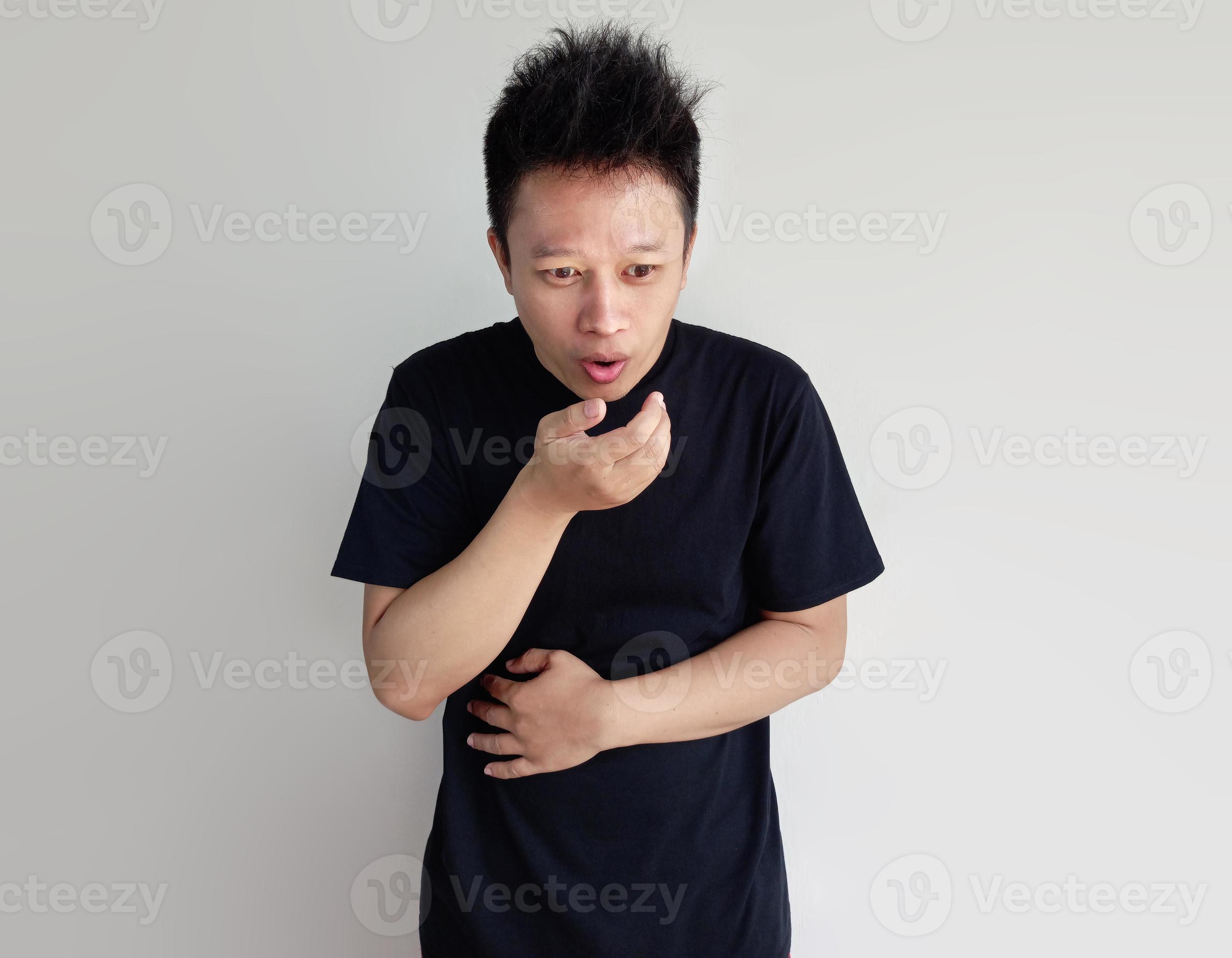 Young man having stomach ache and nausea isolated on plain background