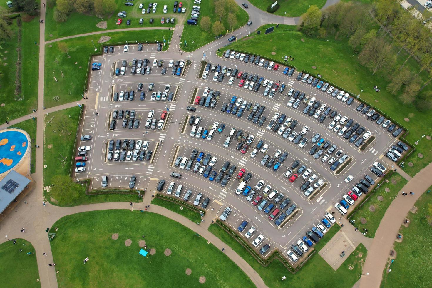 beautiful View of Willen Lake Park with Local and Tourist Public Enjoying the Beauty of Lake and Park by Walking Around with Their Families. Footage Was Captured on 09-April-2023 at Milton Keynes UK photo