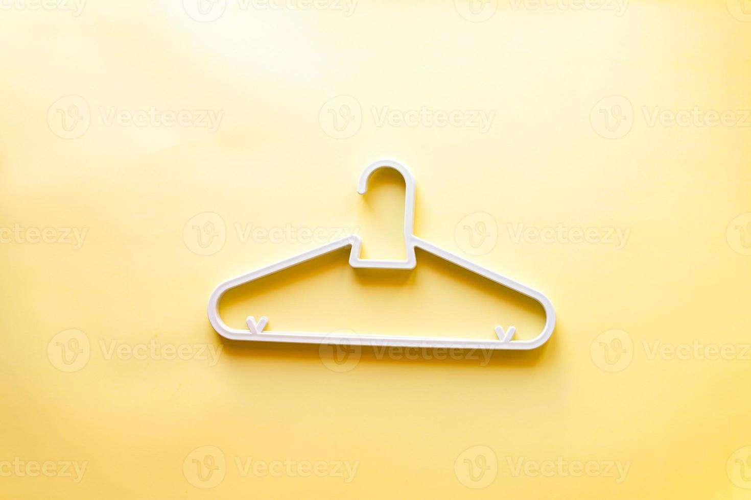 Children is white clothes hanger photo