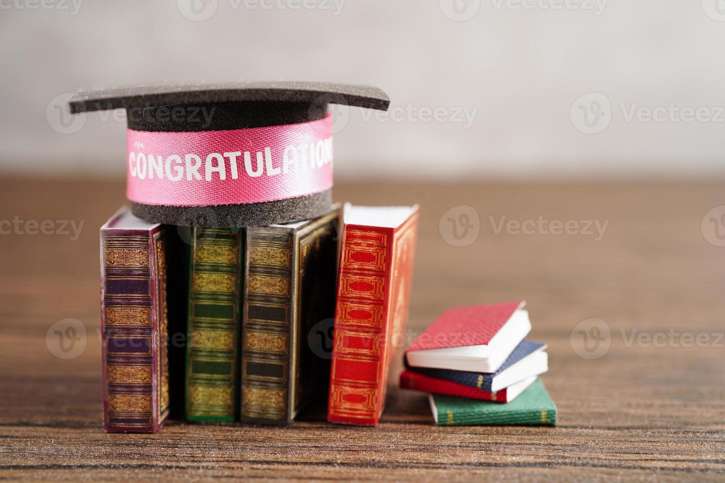 Graduation hat on book with copy space, learning university education concept. photo