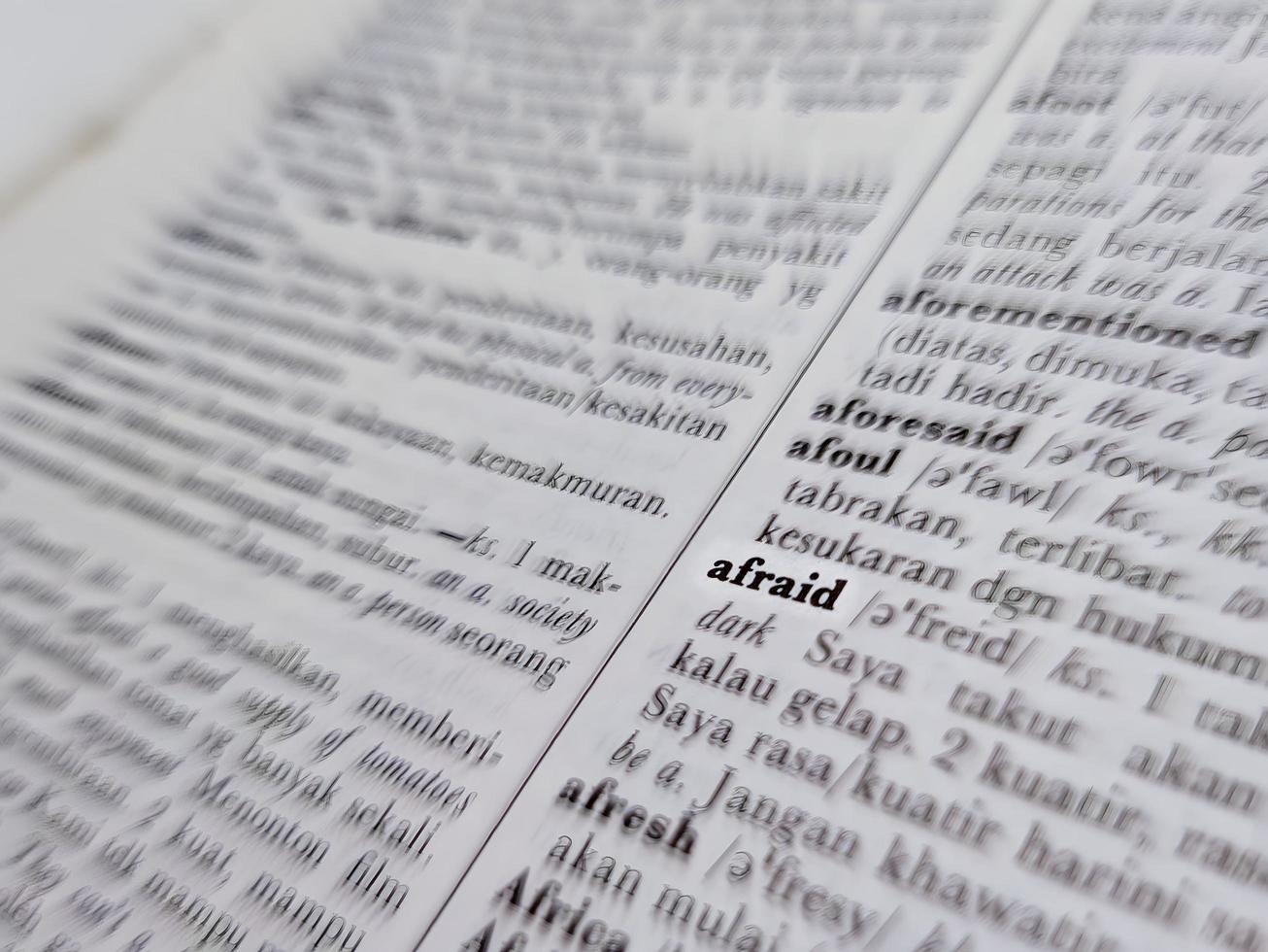 a close up of the word afraid in the English to Indonesian dictionary. For word background or wallpaper photo