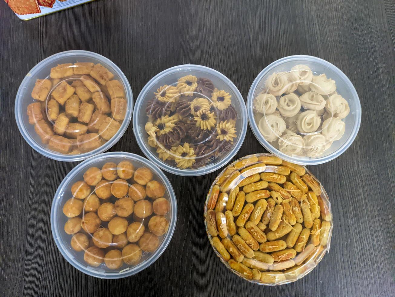 A various snacks of pastries served on the table at the celebration of Eid al-Fitr in Indonesia photo