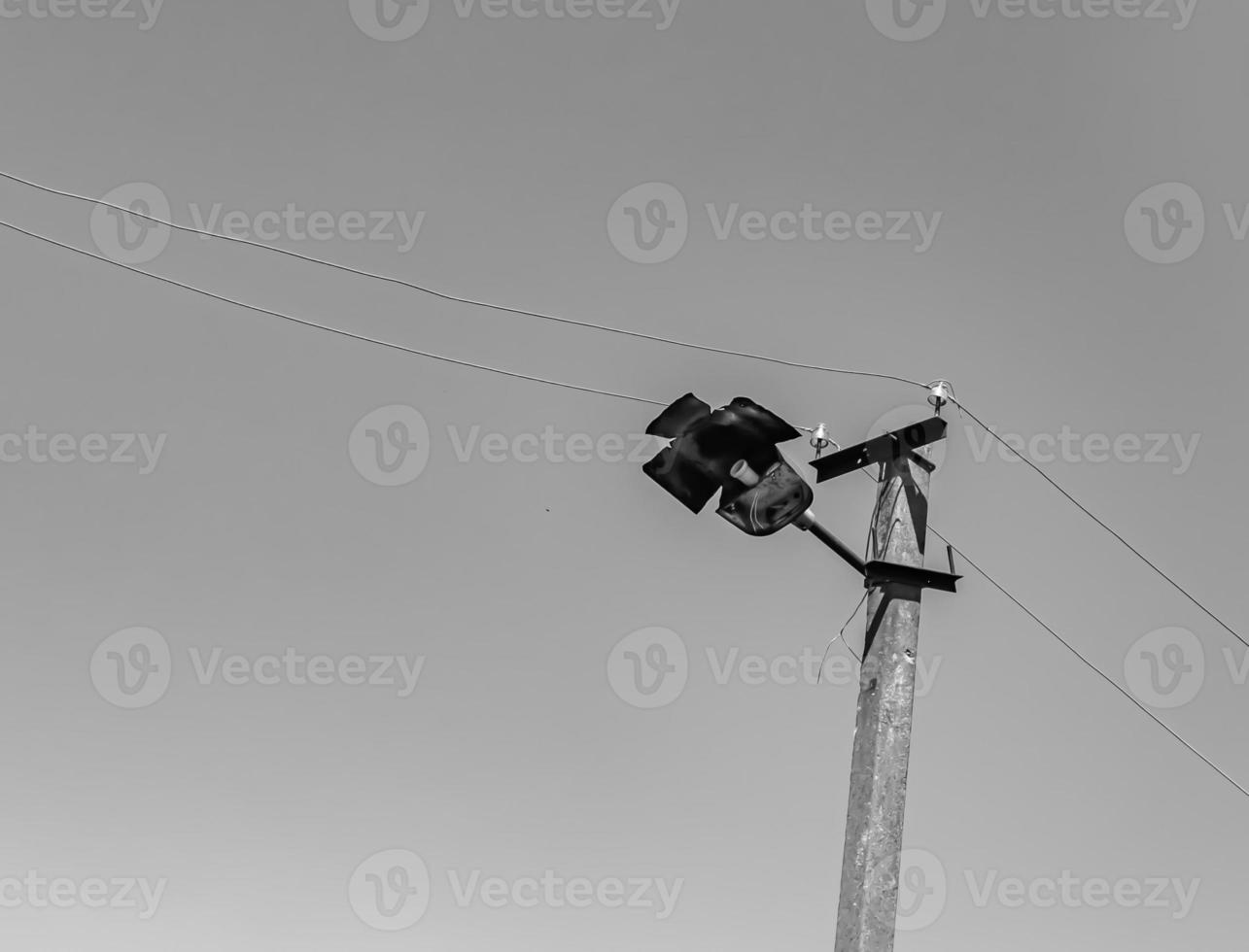 Power electric pole with line wire on light background close up photo