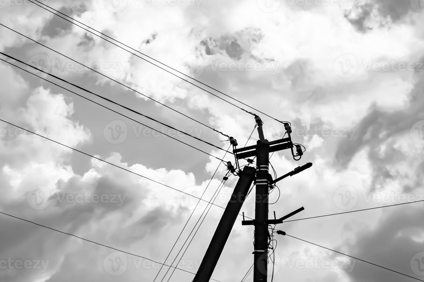 Power electric pole with line wire on light background close up photo