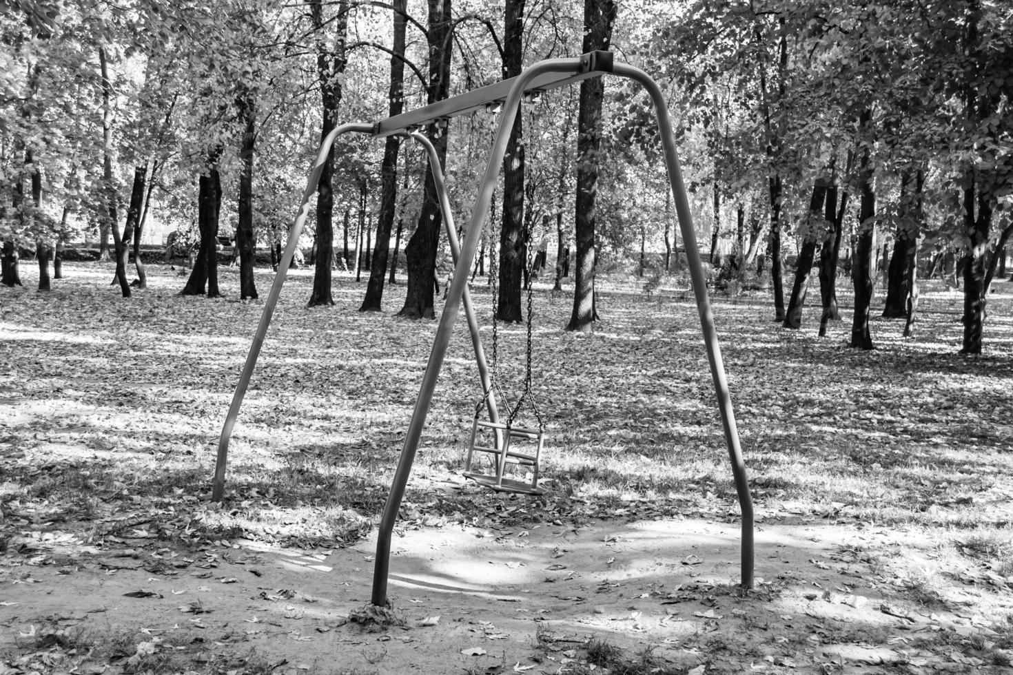 Photography on theme empty playground with metal swing for kids photo
