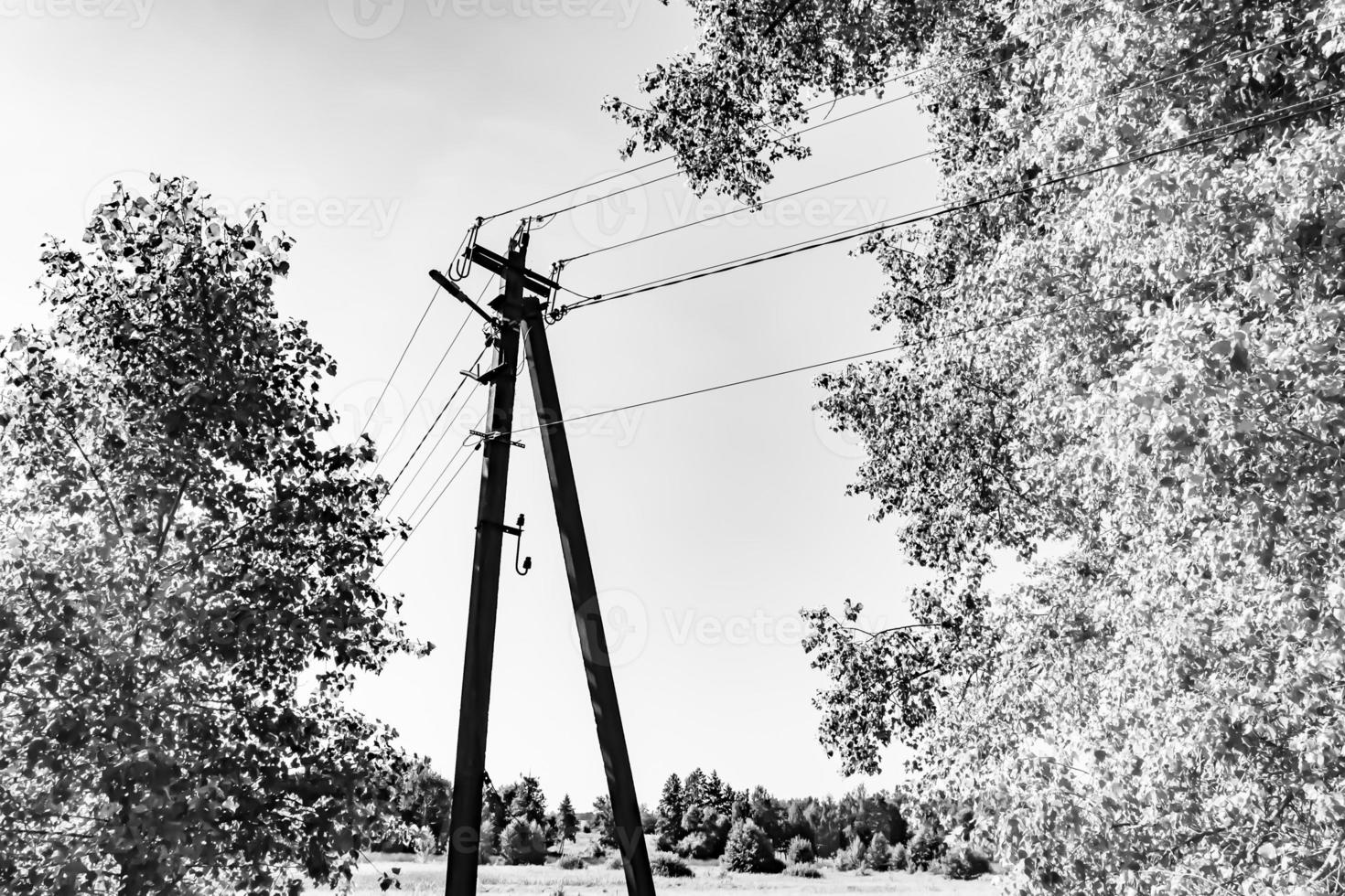 Power electric pole with line wire on light background close up photo