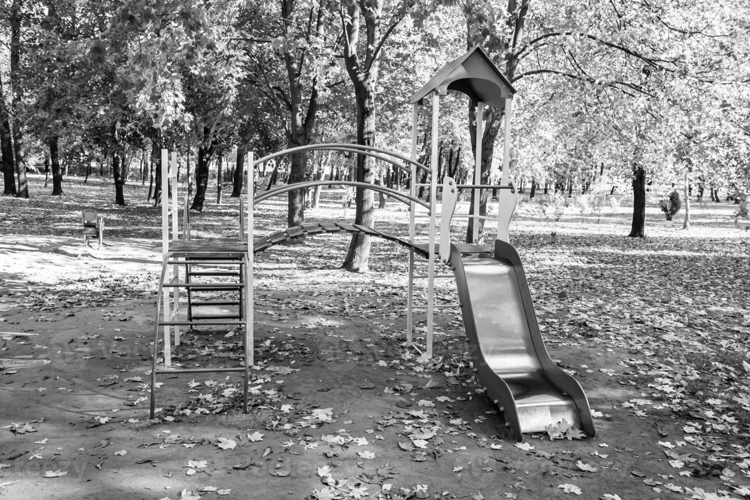 Photography on theme empty playground with metal slide for kids photo