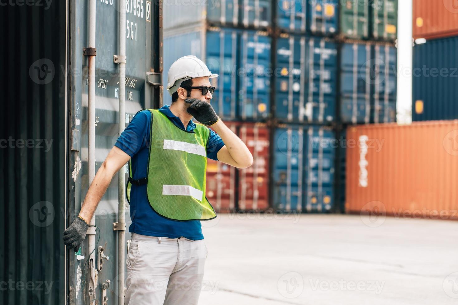Engineer wear safety uniform check control loading freight cargo container use computer laptop at commercial dock warehouse,transportation import,export logistic industrial service photo