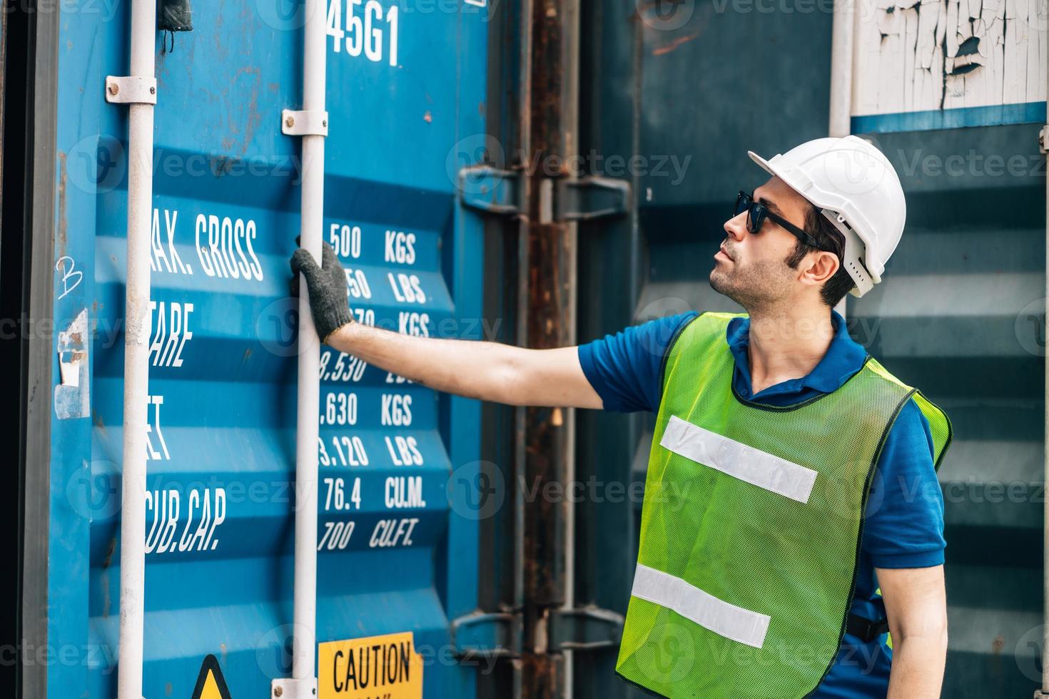 Engineer wear safety uniform check control loading freight cargo container use computer laptop at commercial dock warehouse,transportation import,export logistic industrial service photo