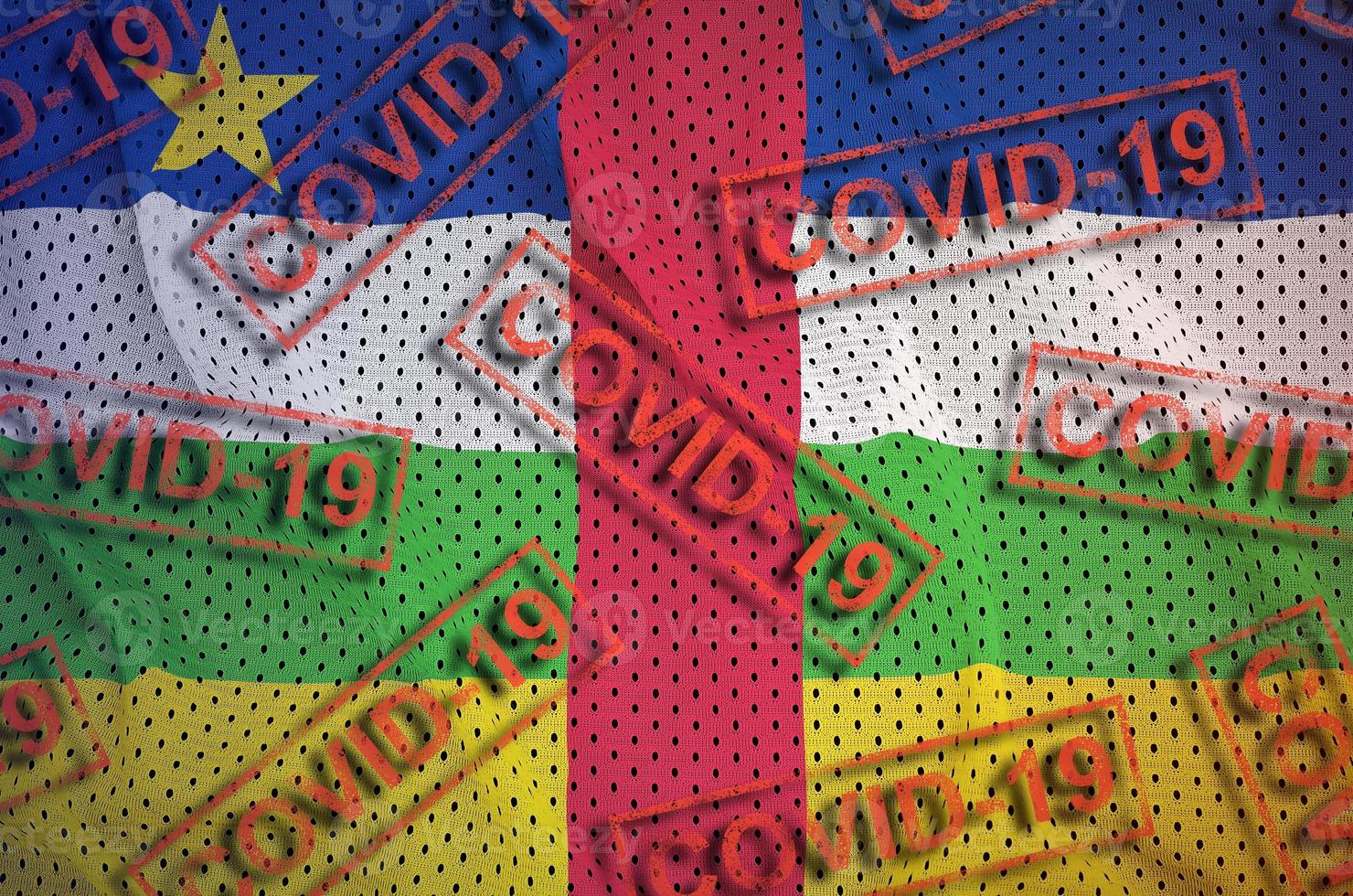 Central African Republic flag and many red Covid-19 stamps. Coronavirus or 2019-nCov virus concept photo