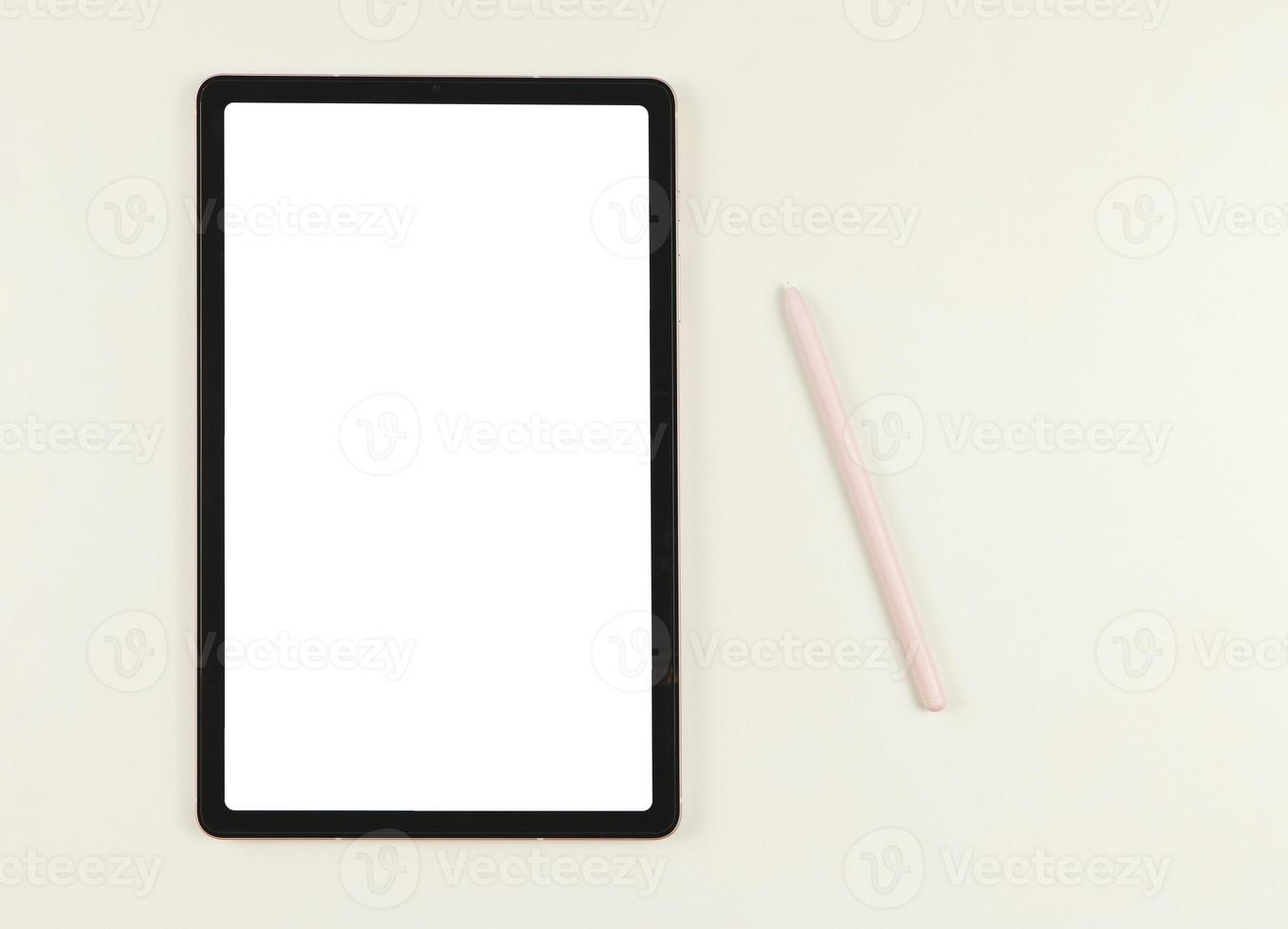flat lay of digital tablet with blank white screen and pink stylus pen isolated on white background. photo