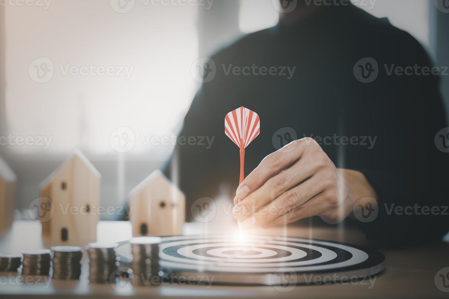 Targeting the business concept, Businessman touch red arrow dart to the virtual target dartboard, Executive marketing, investment goal and target for business investment concept, mini home. photo