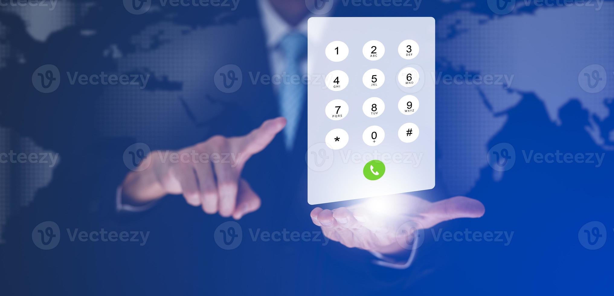 Dialing on virtual telephone keypad with transparent telephone buttons, businessman touch button of telephone number on screen, Finger touch number on smartphone to make a call, close up, photo