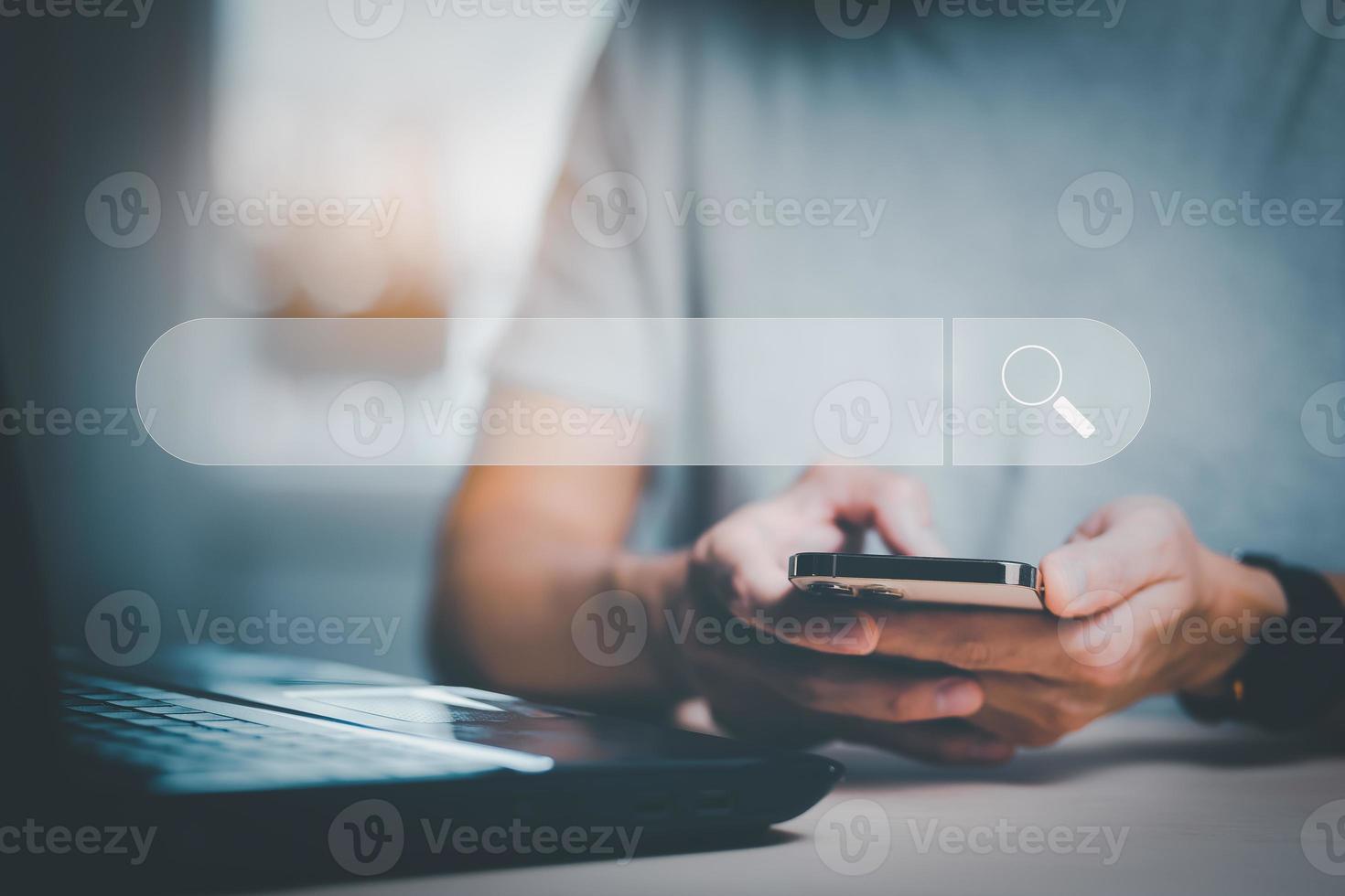 Searching Browsing Internet Data Information with blank search bar. man's hands are using smartphone and keyboard to Searching for information. Using Search Console with your website. photo