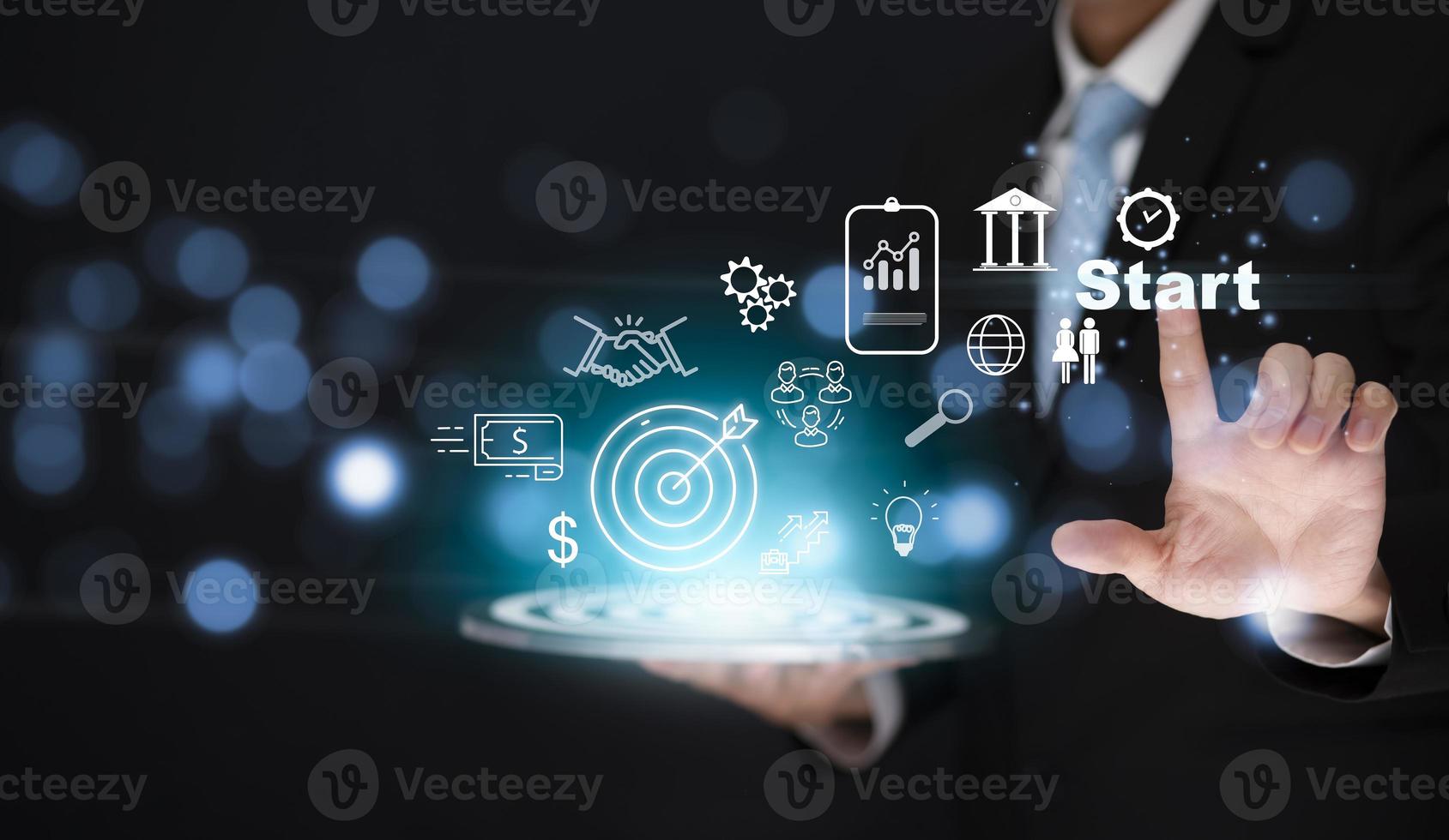 New Targeting the icon business and human concept, Businessman holding virtual target dart board and touch Start word ,Executive marketing, investment goal and target for business investment concept. photo