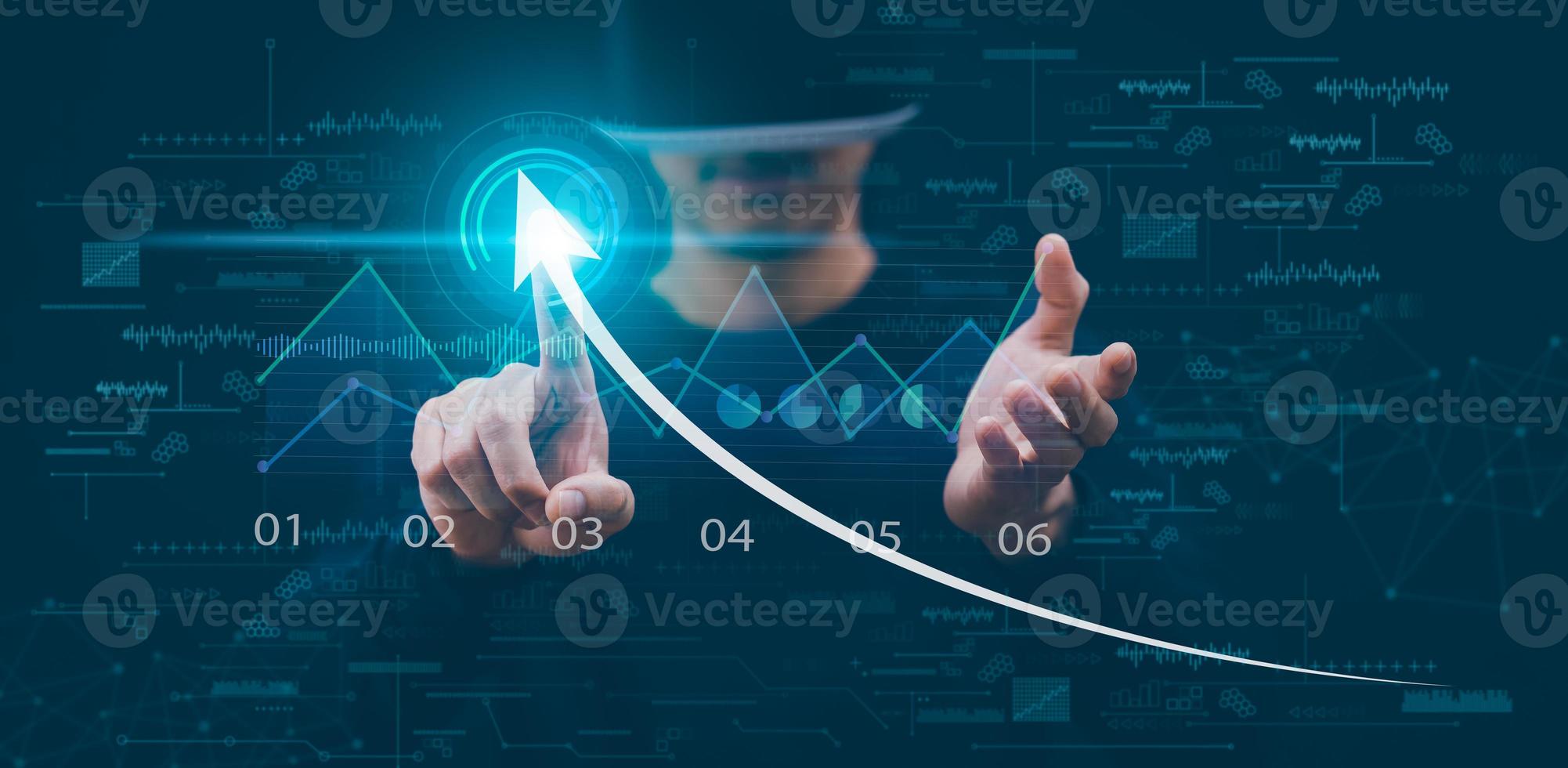 Man wearing VR glasses virtual touch arrow of Investment finance chart stock market business and financial growth graph,Business strategy development and growing growth plan, growth graph Technology. photo