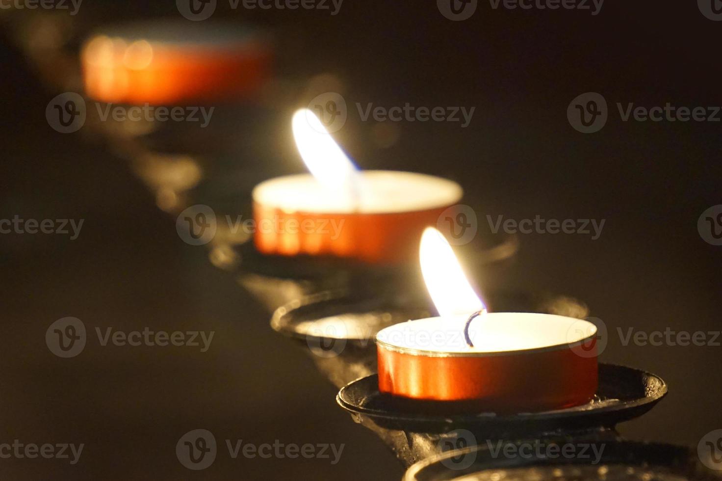 Burning Small Candles - Selective Focus - Religion Concept photo