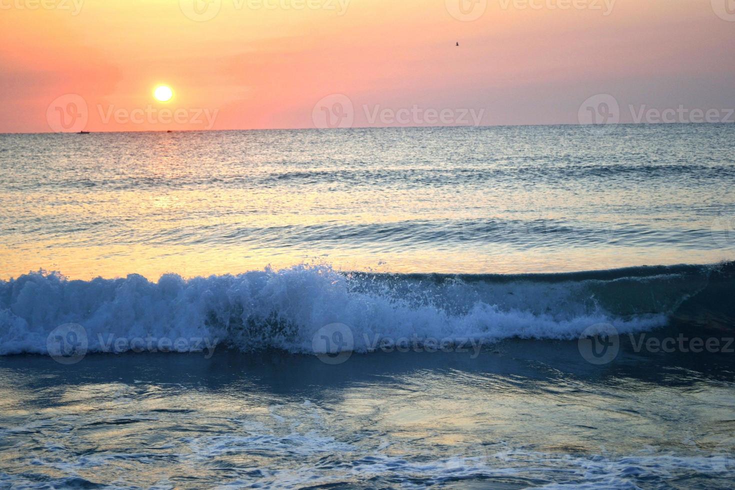 Sea Shore with Waves and Sunset photo