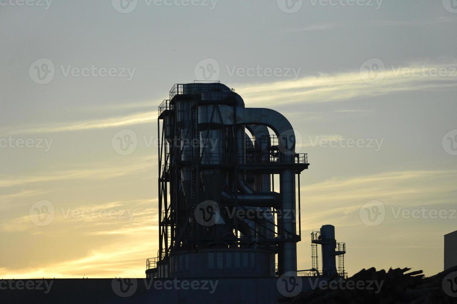 Metal Pipes in Factory, Sunset Sky photo