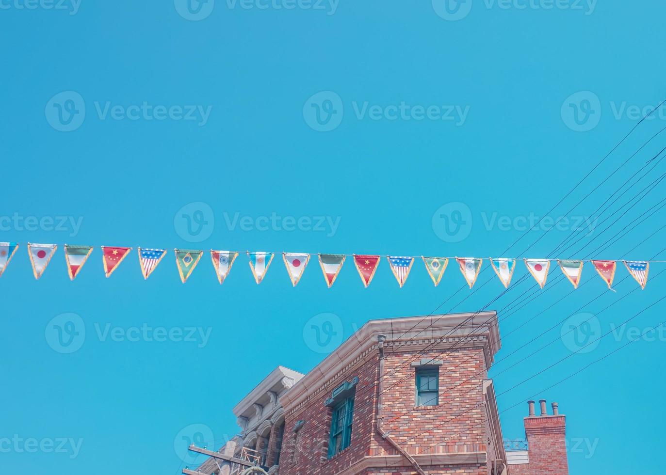 A brick building with flags on it photo