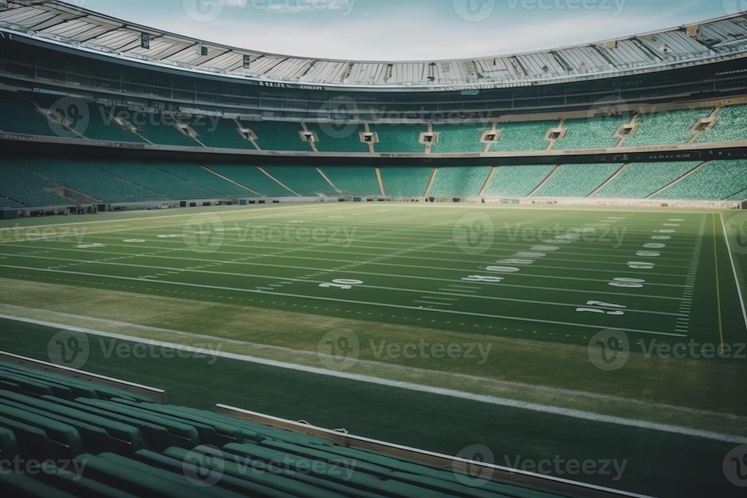 Green field game ready at midfield in an American football stadium. photo